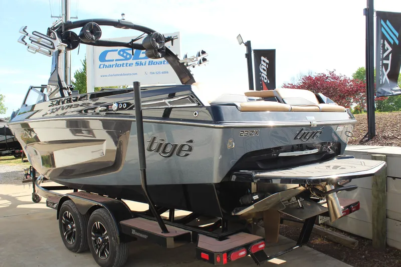 Slide: The Image of 2022 Tigé 23ZX boat on trailer at Charlotte Ski Boats dealership. - 4