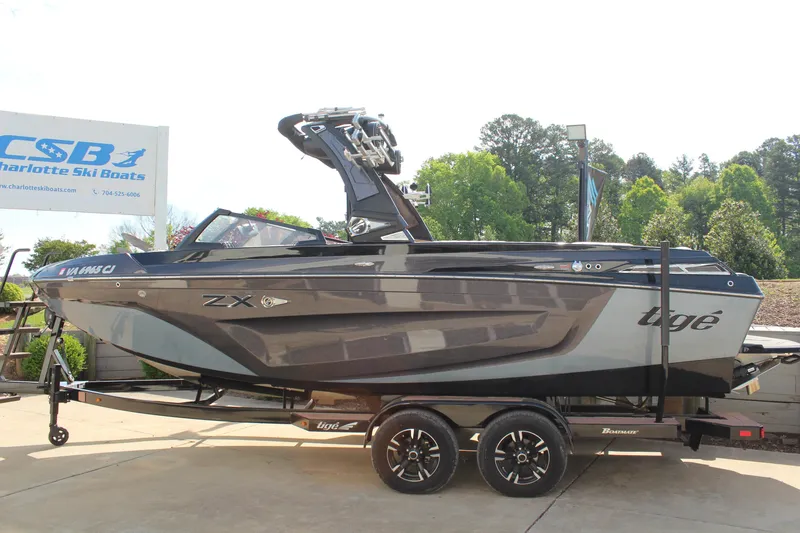 Slide: The Image of 2022 Tigé 23ZX boat on trailer at Charlotte Ski Boats dealership. - 5