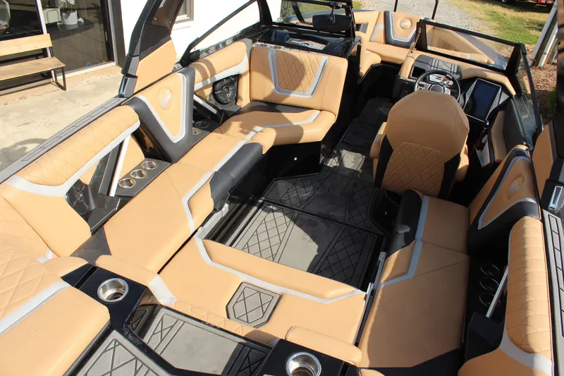 Slide: The Image of Luxurious interior of 2022 Tigé 23ZX boat with tan upholstery and modern design. - 9