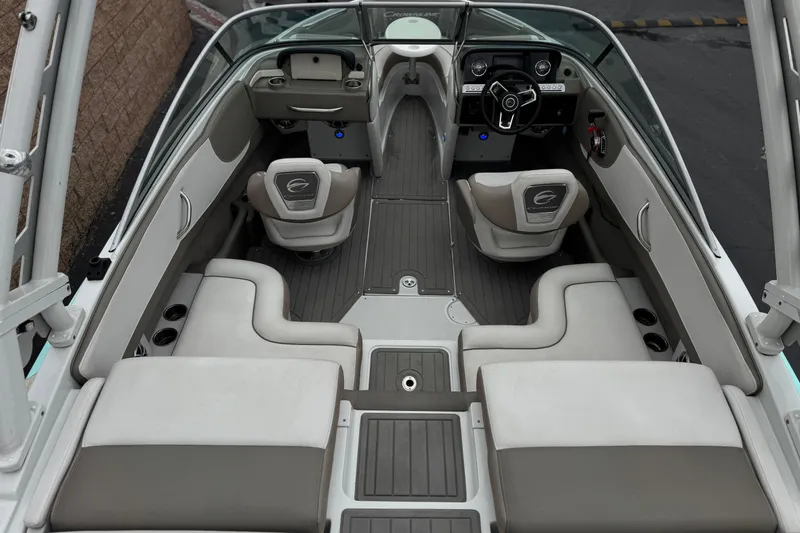 Slide: The Image of 2022 Crownline 220 SS SURF boat interior with sleek seating and modern dashboard design. - 10