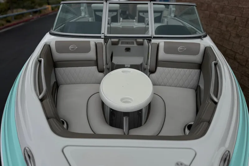 Slide: The Image of 2022 Crownline 220 SS SURF boat interior with seating and table. - 13