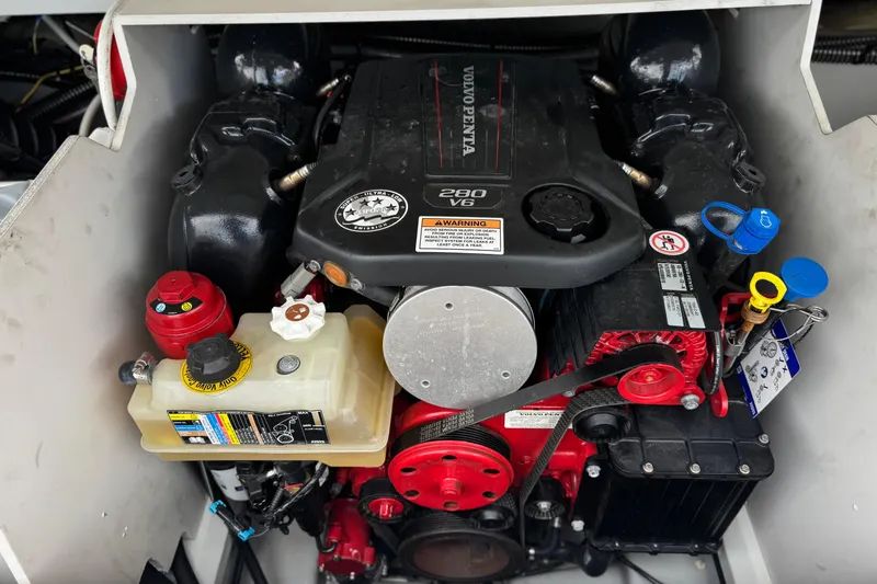 Slide: The Image of Engine compartment of a 2022 Crownline 220 SS SURF boat with Volvo Penta V6 engine. - 23