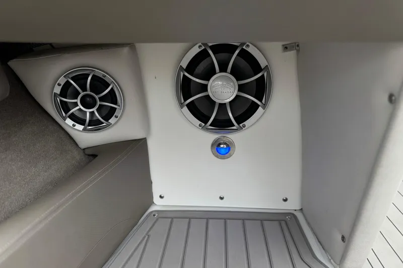 Slide: The Image of 2022 Crownline 220 SS SURF boat interior speakers and flooring detail. - 29