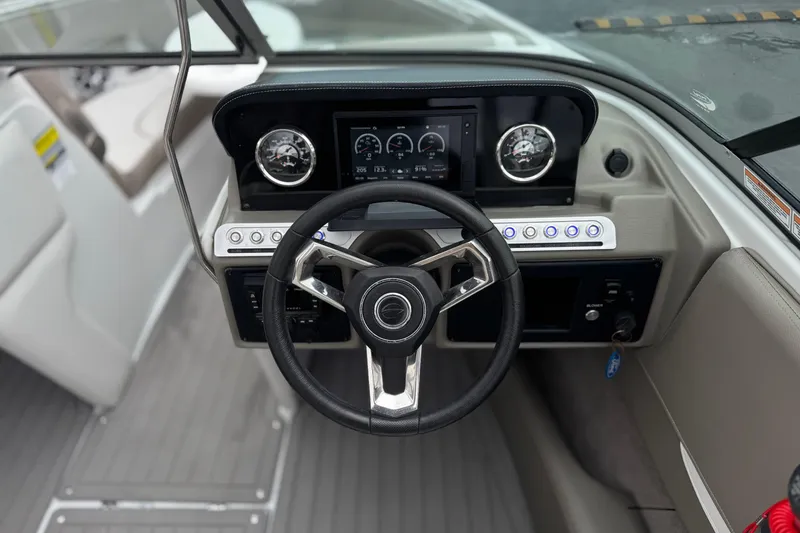 Slide: The Image of Steering wheel and dashboard of 2022 Crownline 220 SS SURF boat. - 31