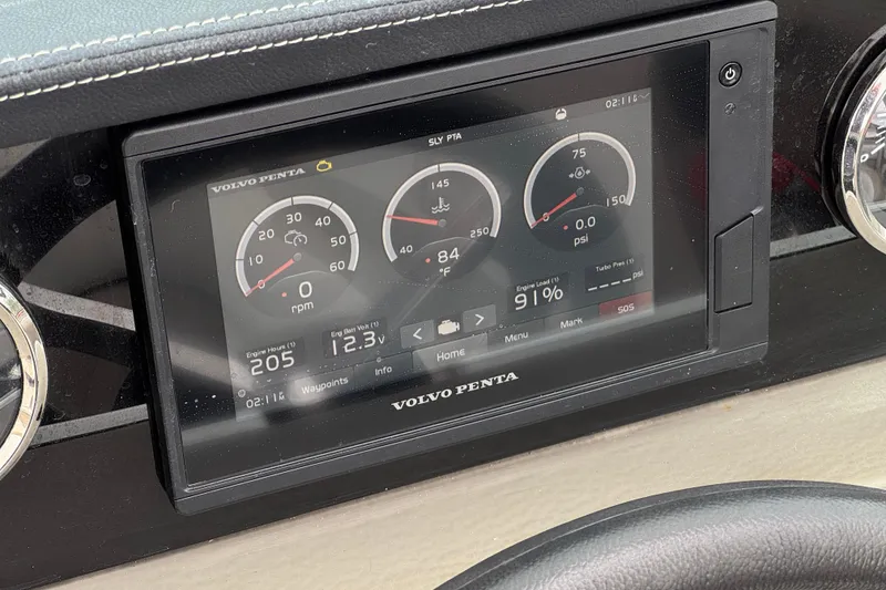Slide: The Image of Dashboard of 2022 Crownline 220 SS SURF with Volvo Penta display showing engine metrics. - 33