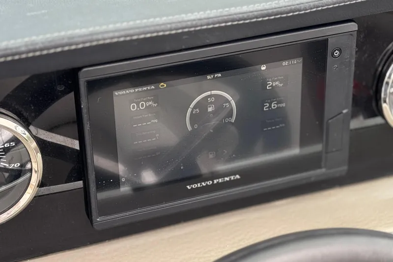 Slide: The Image of Dashboard of 2022 Crownline 220 SS SURF with Volvo Penta display showing fuel data. - 34