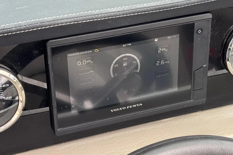 Slide: The Image of Volvo Penta display on 2022 Crownline 220 SS SURF boat dashboard, showing fuel metrics. - 35