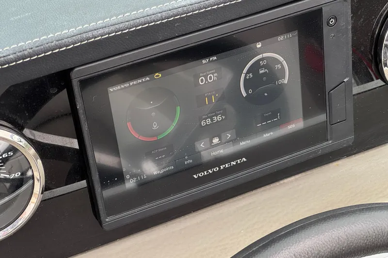 Slide: The Image of Dashboard of 2022 Crownline 220 SS SURF with Volvo Penta display showing boat metrics. - 36