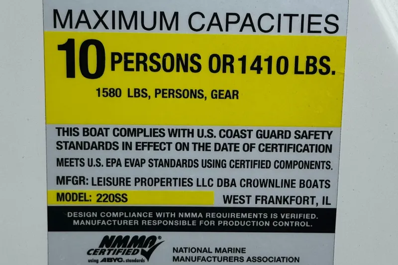 Slide: The Image of 2022 Crownline 220 SS SURF boat capacity label, 10 persons or 1410 lbs, safety standards compliant. - 39