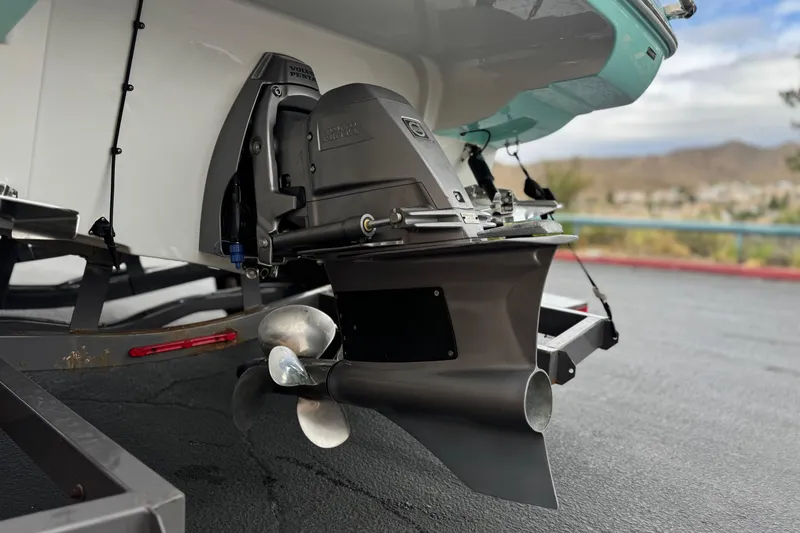 Slide: The Image of 2022 Crownline 220 SS SURF boat's propeller and stern drive on a trailer. - 8
