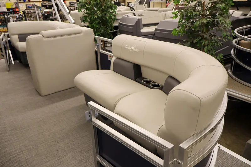 Slide: The Image of SunChaser Vista 18 Fish 2025 boat interior with plush seating and cup holders. - 5