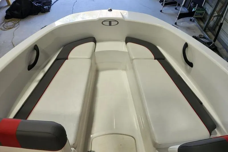 Slide: The Image of Interior of a 2022 Tahoe T16 boat with cushioned seating. - 7