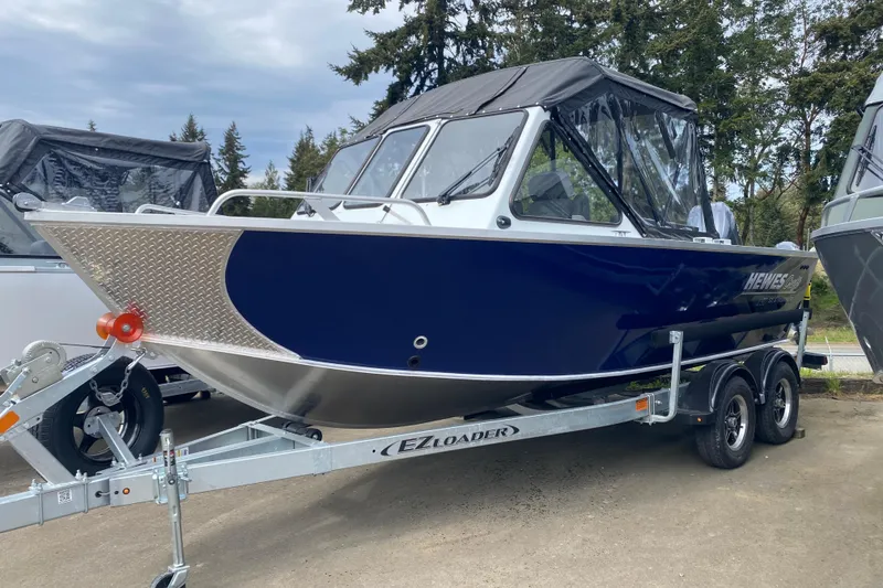 The Image of 2026 Hewescraft 190 Sea Runner on trailer outdoors. - 1