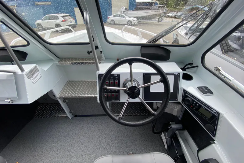 Slide: The Image of Interior view of 2026 Hewescraft 190 Sea Runner cockpit. - 11