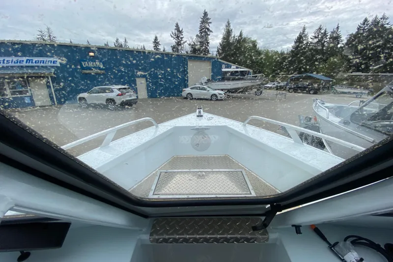 Slide: The Image of Interior view of 2026 Hewescraft 190 Sea Runner at marina. - 15