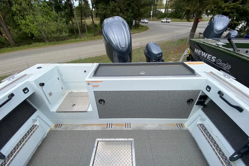 Slide: The Image of 2026 Hewescraft 190 Sea Runner with spacious deck and engine view. - 9