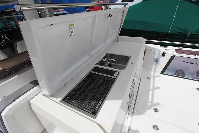 Slide: The Image of 2018 Axopar 37 Sun-Top boat with outdoor sink and grill station. - 10