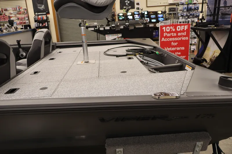 Slide: The Image of 2026 Smoker Craft Viper 175 Pro boat interior with seating and storage compartments. - 10