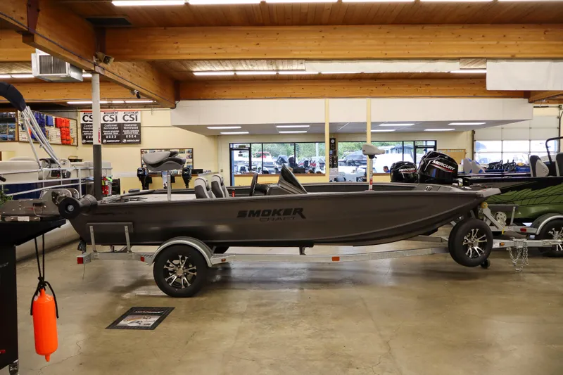 Slide: The Image of 2026 Smoker Craft Viper 175 Pro boat displayed indoors on a trailer. - 3