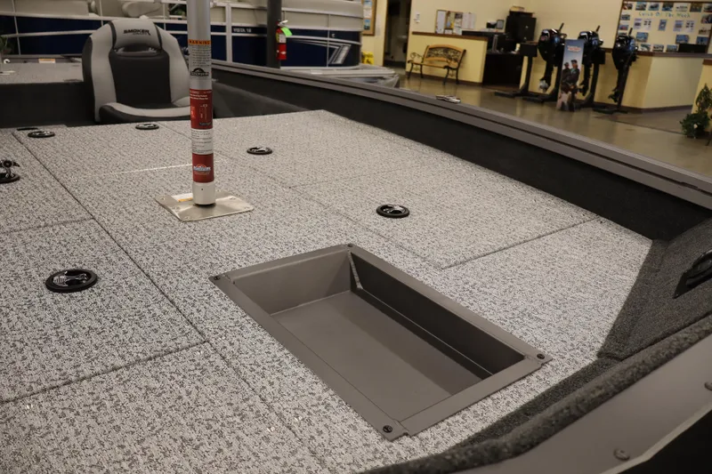 Slide: The Image of 2026 Smoker Craft Viper 175 Pro boat interior with storage compartments and seating. - 6
