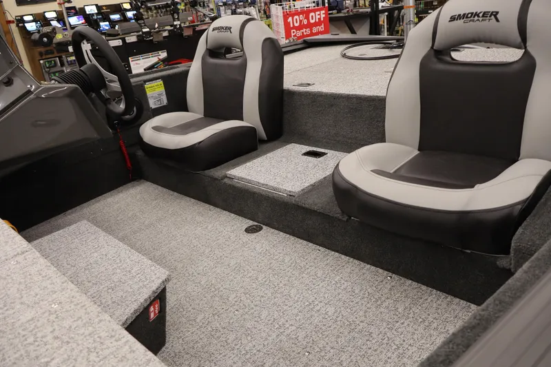 Slide: The Image of 2026 Smoker Craft Viper 175 Pro boat interior with gray and black seating. - 9