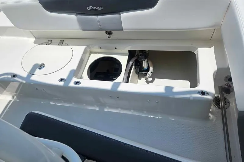 Slide: The Image of 2021 Robalo R202 Explorer boat interior with storage compartments and seating. - 10