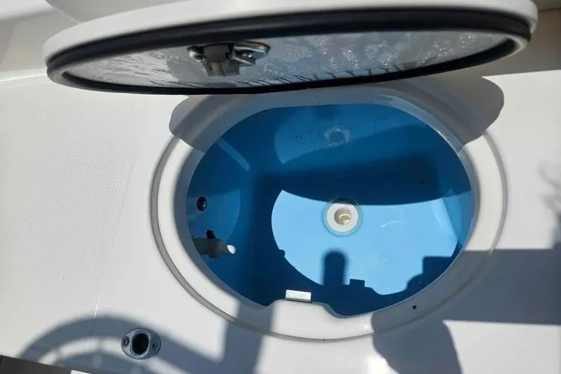 Slide: The Image of Livewell compartment on a 2021 Robalo R202 Explorer boat, open lid view. - 12