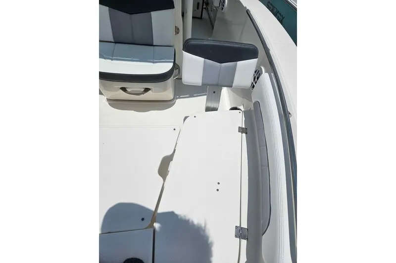Slide: The Image of 2021 Robalo R202 Explorer boat interior with cushioned seating and sleek design. - 14