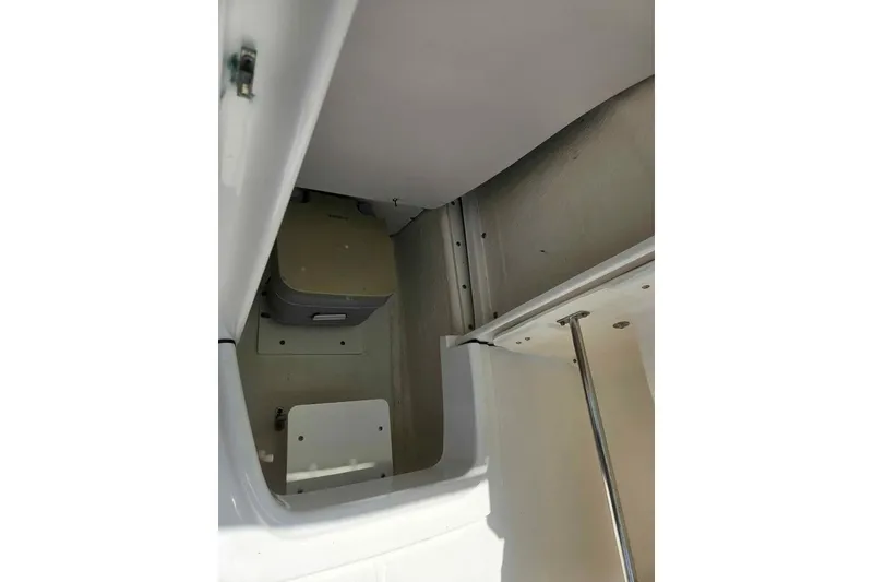 Slide: The Image of Interior compartment of 2021 Robalo R202 Explorer boat, showcasing storage space. - 16