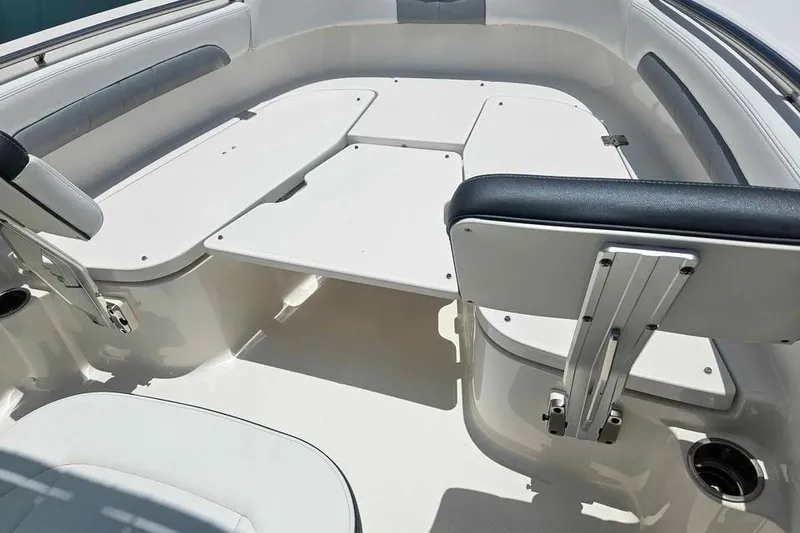 Slide: The Image of 2021 Robalo R202 Explorer boat interior with seating and storage compartments. - 5