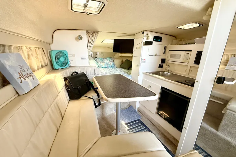 Slide: The Image of Mini fridge in 1998 Rinker Fiesta Vee 280 boat with drinks inside. - 19