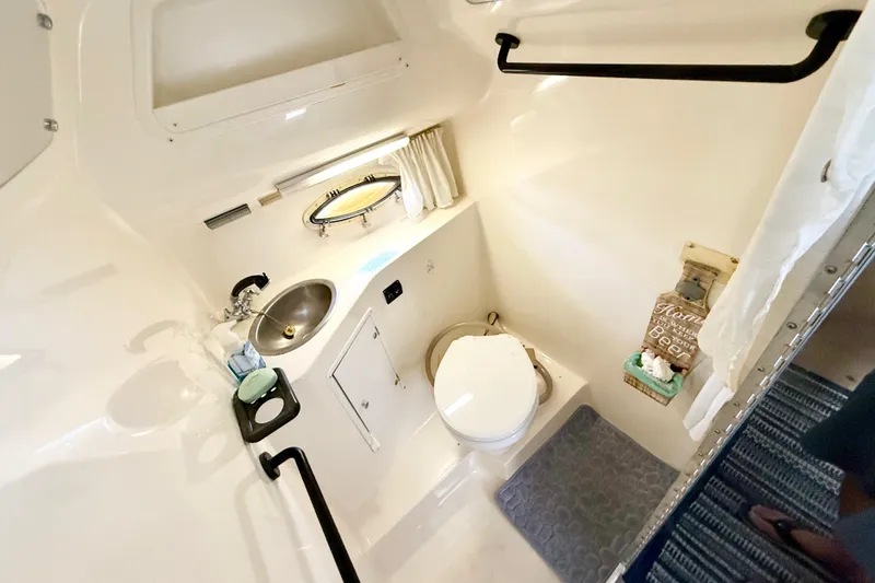 Slide: The Image of Electrical control panel on a 1998 Rinker Fiesta Vee 280 boat. - 21