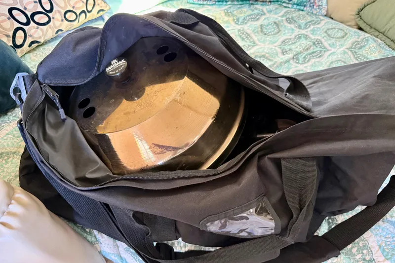 Slide: The Image of 1998 Rinker Fiesta Vee 280 cabin interior with cozy seating and table setup. - 25