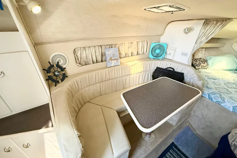 Slide: The Image of Engine compartment of a 1998 Rinker Fiesta Vee 280 boat, featuring dual MerCruiser engines. - 26