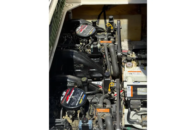 Slide: The Image of Engine compartment of a 1998 Rinker Fiesta Vee 280 with MerCruiser engines. - 27