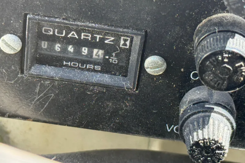 Slide: The Image of 1998 Rinker Fiesta Vee 280 boat docked at marina, featuring white exterior and green canopy. - 29