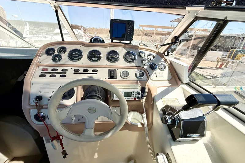 Slide: The Image of Interior of a 1998 Rinker Fiesta Vee 280 boat with seating and sleeping area. - 9
