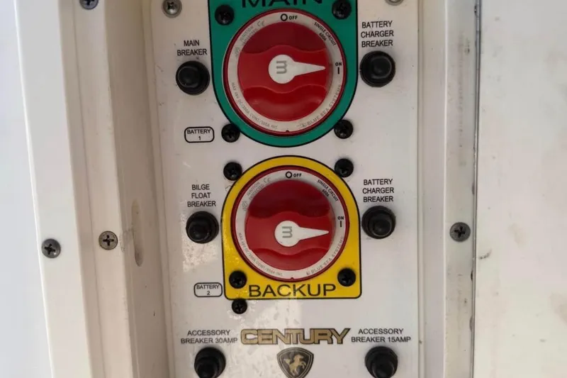 Slide: The Image of Control panel of a 2007 Century 2102 Inshore boat with main and backup switches. - 11