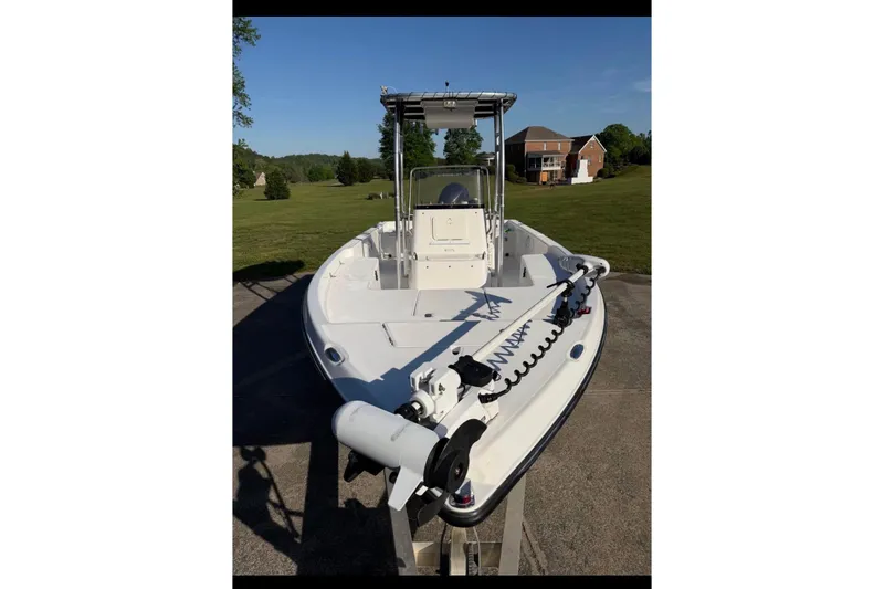 Slide: The Image of 2007 Century 2102 Inshore boat on trailer, parked in a residential driveway. - 13