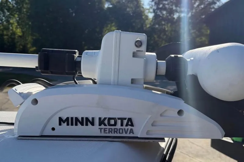 Slide: The Image of Minn Kota Terrova trolling motor on 2007 Century 2102 Inshore boat, sunny day background. - 14