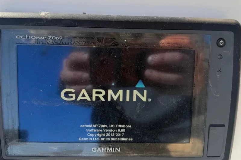 Slide: The Image of Garmin echoMAP 70dv on 2007 Century 2102 Inshore boat, displaying startup screen. - 3
