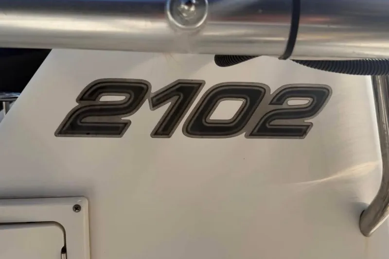 Slide: The Image of Century 2102 Inshore 2007 boat model emblem on white surface. - 7