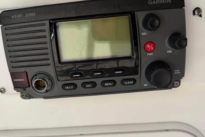 Slide: The Image of Garmin VHF 200 marine radio on a 2007 Century 2102 Inshore boat dashboard. - 9