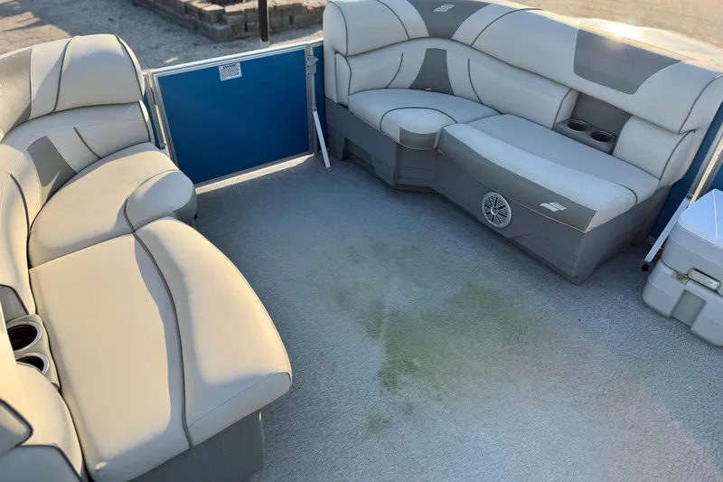 Slide: The Image of 2018 Starcraft EX 22 C SG pontoon boat interior with plush seating and cup holders. - 20