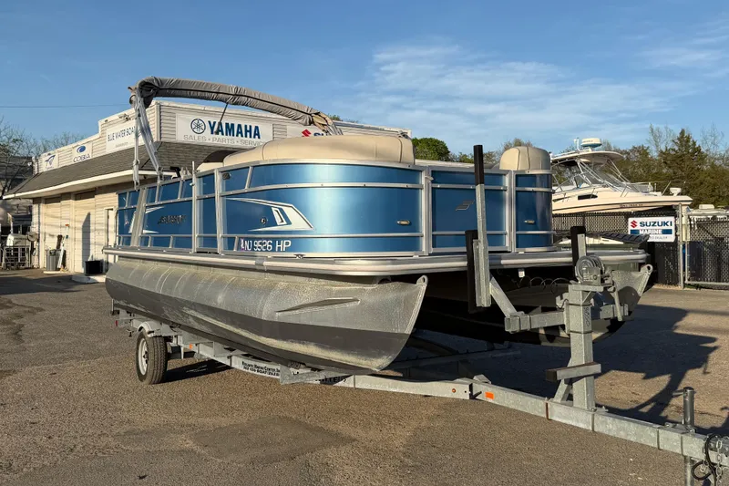 Slide: The Image of 2018 Starcraft EX 22 C SG pontoon boat on trailer at dealership. - 5