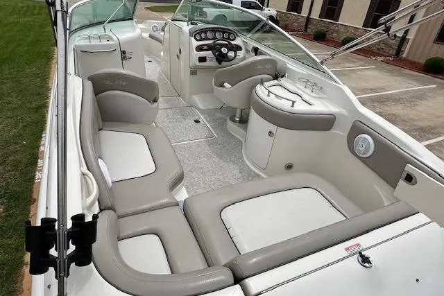 Slide: The Image of 2004 Sea Ray 270 Sundeck boat interior with seating and helm. - 11