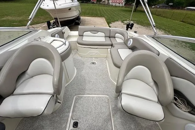 Slide: The Image of Interior of a 2004 Sea Ray 270 Sundeck boat with plush seating. - 15
