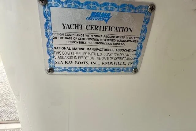 Slide: The Image of Yacht certification plaque on 2004 Sea Ray 270 Sundeck, NMMA certified for safety compliance. - 21