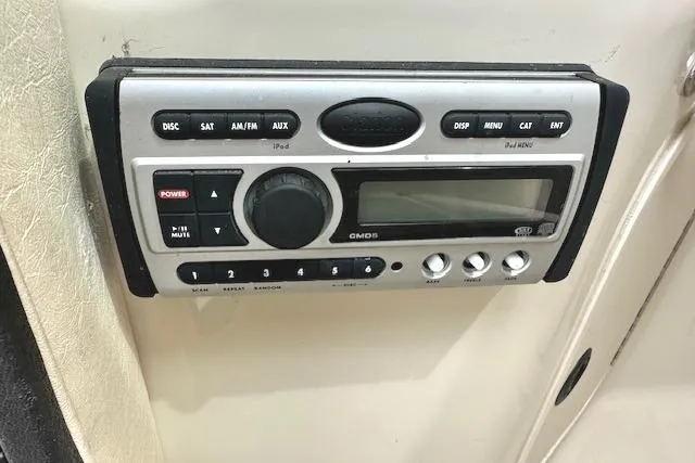 Slide: The Image of 2004 Sea Ray 270 Sundeck stereo system with various control buttons and display. - 23