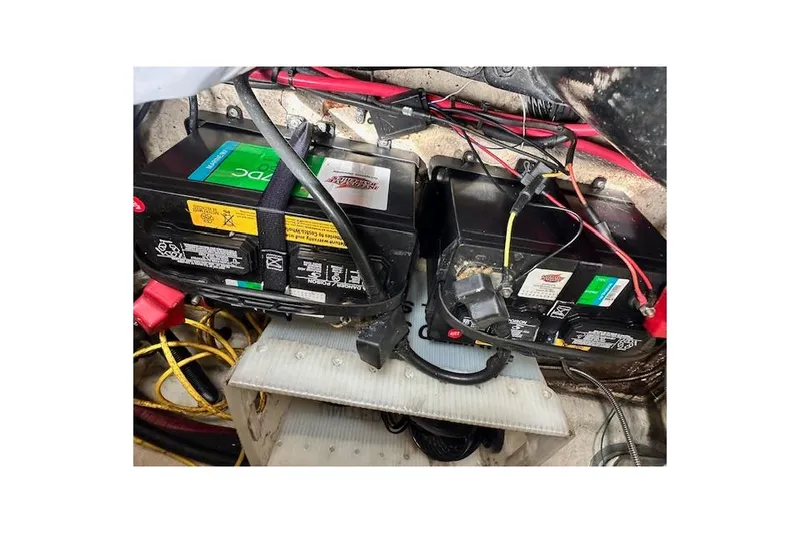 Slide: The Image of Batteries in a 2004 Sea Ray 270 Sundeck boat engine compartment. - 27